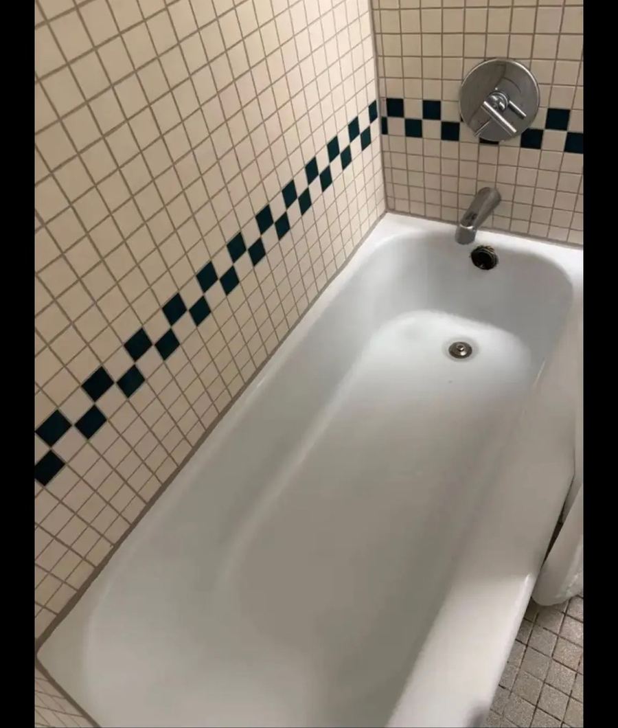 Clean white bathtub after restoration cleaning