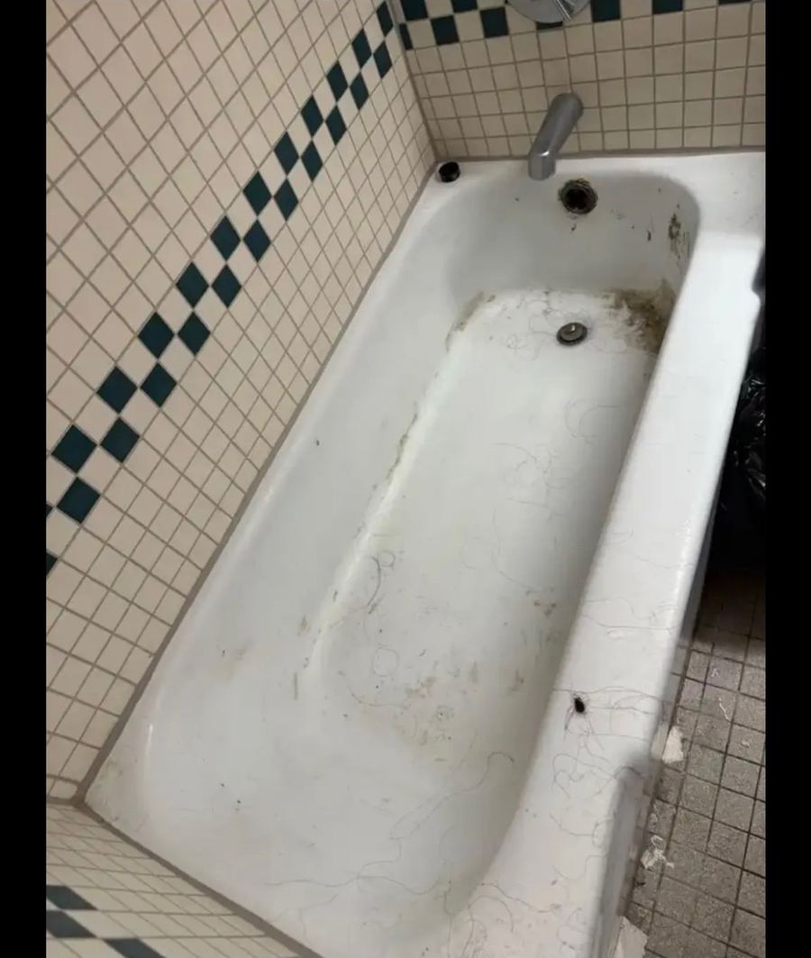 Stained bathtub before restoration cleaning